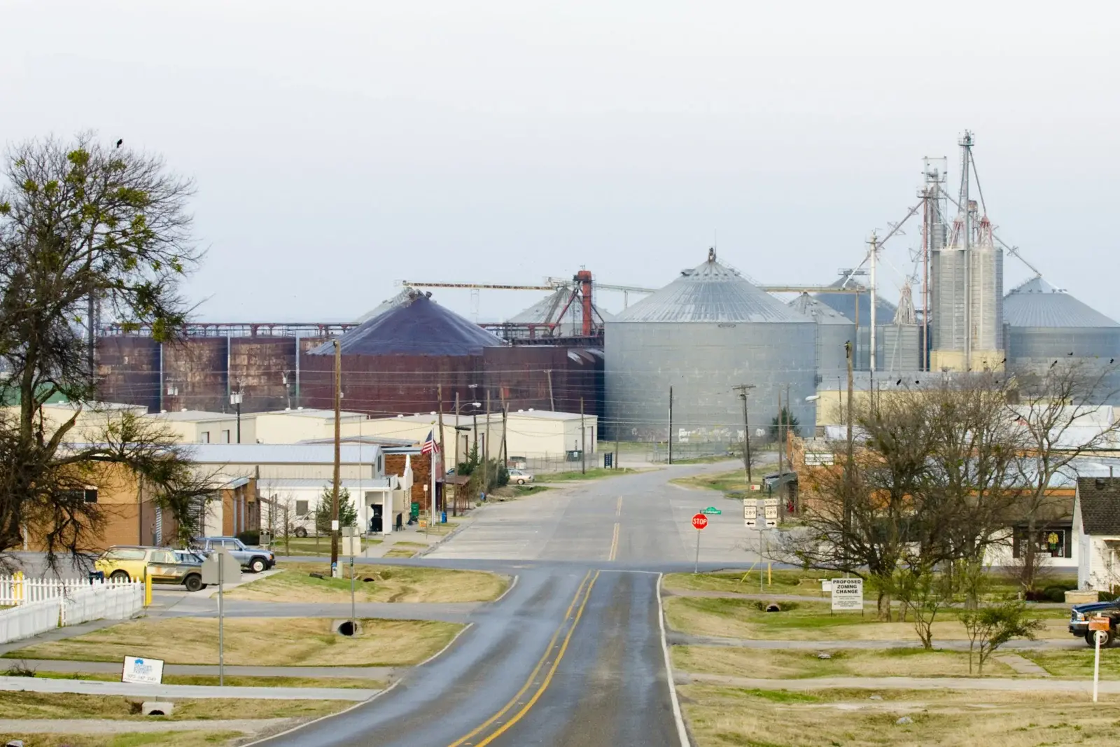 A street leading toward grain silos in Prosper, Texas