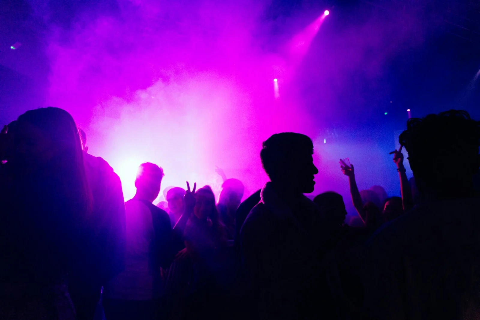 Concert crowd under purple lighting